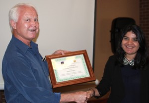 Dr. Jones presents the Pellegrin Scholarship award to Samra Khan. (Photo by W.C. Wiese)